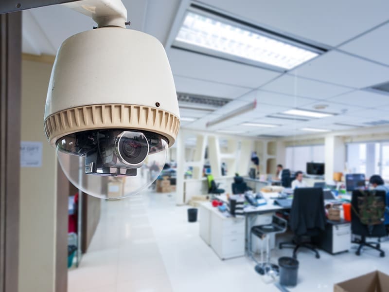 camera mounted to the side of a wall in an office